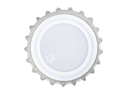 macro shot of metal cover from the glass bottles for beverages, the crown finish cap, stack focus added, isolated on whiteの写真素材