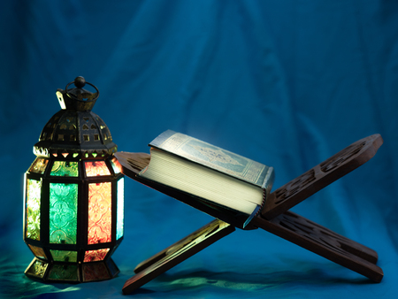 Quran or Kuran, the islamic holy book, in dark backgroundの写真素材