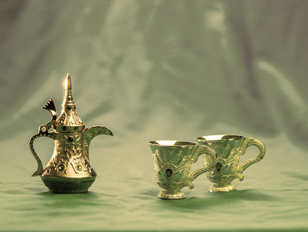 beautiful Turkey style of tea set, placed on blue cloths backgroundの写真素材