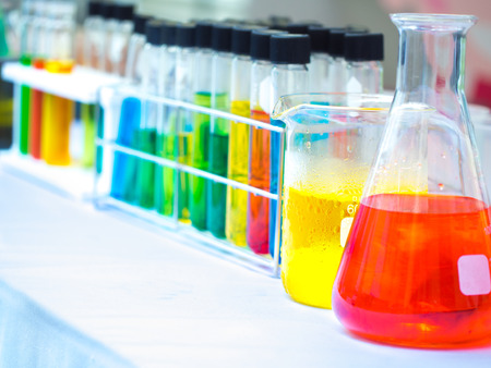 colorful chemical substance in the clear test tube and flask in laboratory in study for industry and...