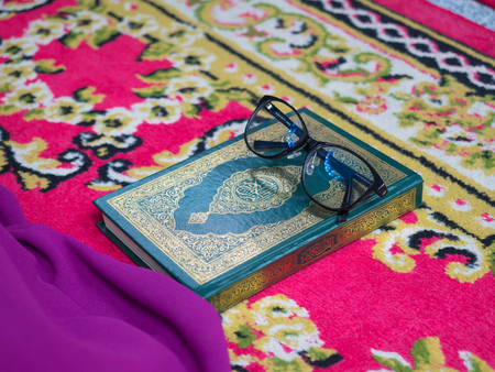 Muslim woman with fully traditional dress praying for Allah, Muslim God, on mosque in ramadan kareem monthの写真素材