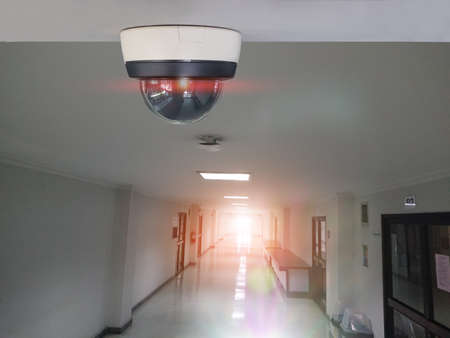 Security CCTV camera installed indoor. Intelligent cameras can record video all day and night to...