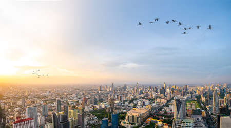 Beautiful Bangkok city, bird eye view on modern new buildings or skyscrapers cityscape on daytime and night time, panoramic scene showing urban skyline and business office towersの写真素材
