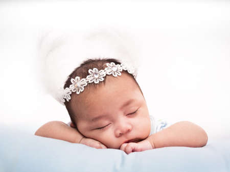 cute baby newborn in lovely action, motherhood conceptの写真素材