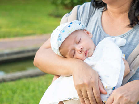 cute three-month baby in lovely action, motherhood concept
