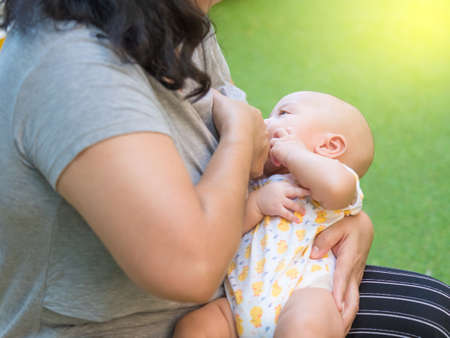 cute three-month baby in lovely action, motherhood concept