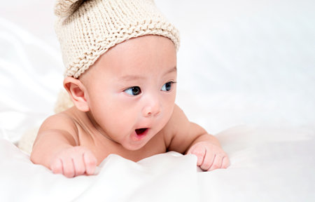 cute newborn three-month baby in lovely action, motherhood conceptの写真素材