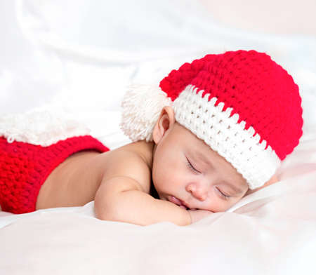 cute newborn three-month baby in lovely action, motherhood conceptの写真素材