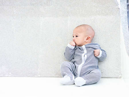 cute four-month baby in lovely action, motherhood concept