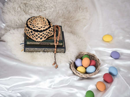 Quran or Kuran ( the islamic holy book) on white background with rosary bead ready to read in ramadan night, muslim style and ramadan conceptの写真素材