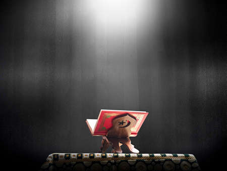 Quran or Kuran ( the islamic holy book) on black background with rosary bead ready to read in ramadan night, muslim style and ramadan conceptの写真素材