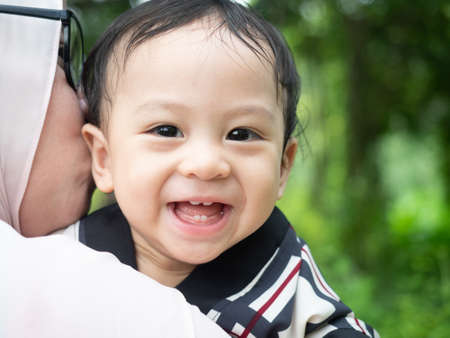 Close up shot of cute asian baby, health care and motherhood concept.の写真素材