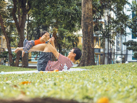 Close up shot of cute asian baby in lovely actions in the outdoor nature, health care and childhood concept.の写真素材
