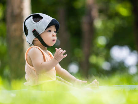 close up shot of cute ten month asian baby  in lovely action, motherhood conceptの写真素材