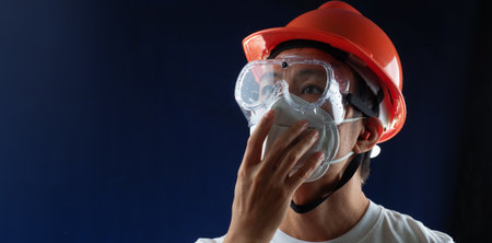 man worker wearing full protection equipments to work duty in the risk atmosphere such as hazard...