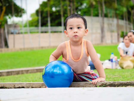 Close up shot of cute asian child in playing activity, health care and motherhood concept.の写真素材