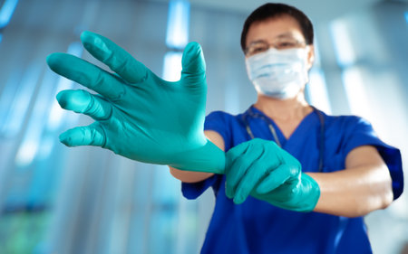 doctor wearing face mask to prepare for surgery case with stethoscopeの写真素材