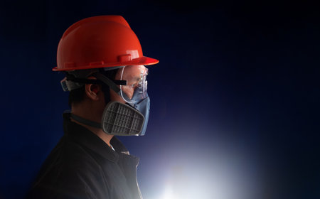 man worker wearing full protection equipments to work duty in the risk atmosphere such as hazard chemical gas or smoke or dust or pm2.5の写真素材