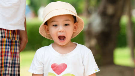 close up shot on happy Asian child  laughing on something in travel trip.の写真素材