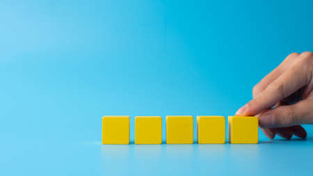 Concept design on wooden blocks on cyan background- easy to insert text and simbols about virus,...