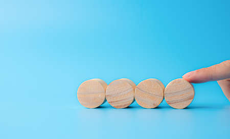 Concept design on wooden blocks on cyan background- easy to insert text and simbols about virus, terror, financial and othersの写真素材