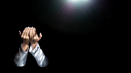 Muslim man with fully traditional white dress praying for Allah, Muslim God, on mosque in ramadan...