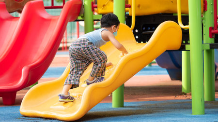 An asian boy playing outdoor activity with excited on something new, learning via outdoor activity, child will going to large world to grow up in the future.の写真素材