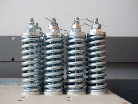 shining metal springs install on indoor use for industrial and metal workの写真素材