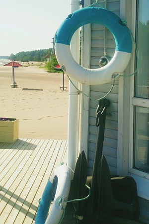 Lifebuoy hanging on a wallの素材