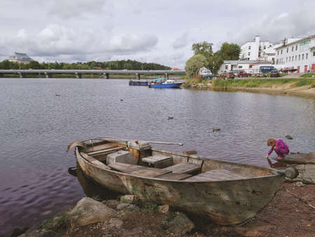 Old rusty boat on a shoreの写真素材