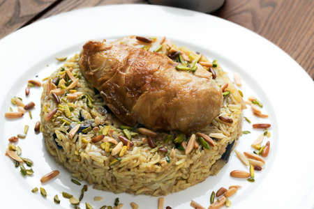 Chicken Maklube. Arabic traditional food made of rice, vegetable and chicken.