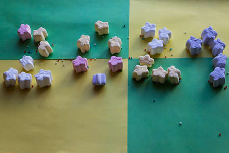 Marshmallow placed on the green-yellow background illustrating number of 2021. Collared marshmallow...