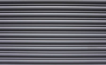 Grey industrial metal blinds. Shop window blinds backgroundの写真素材