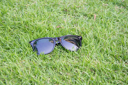 sunglass on lawnの写真素材