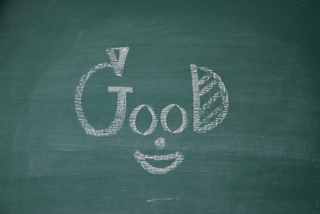 good face smile on chalk boardの写真素材