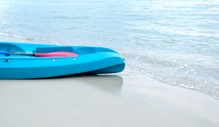 blue boat on sand beachの写真素材
