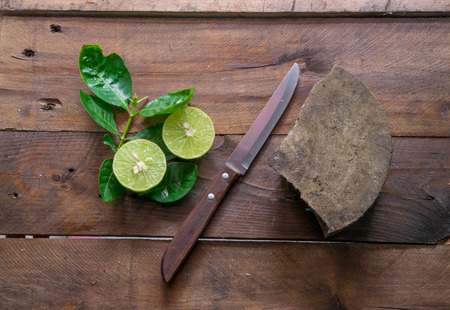 lemons with knifeの写真素材