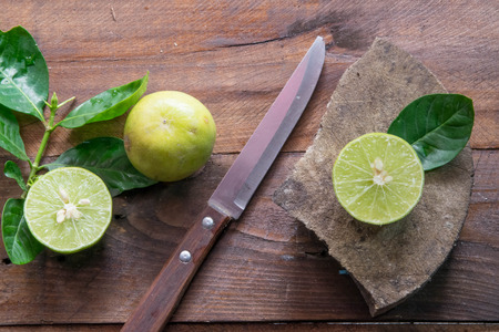 lemons with knife(focus lemon on block)の写真素材