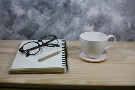 Glasses read with coffee cupの素材