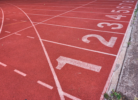 Numbers on running tracks in athletic stadium.