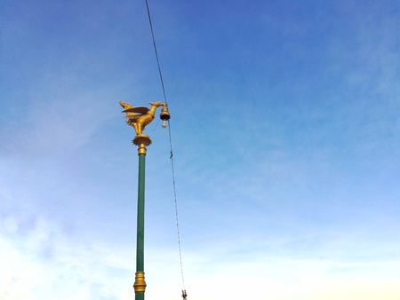 Thai style art, Golden Hongsa Carved on public lamp post.の写真素材