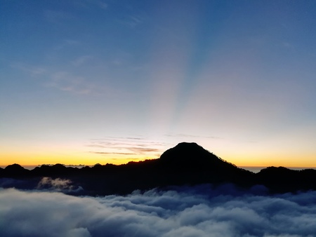 sea of cloud on the top of mountain. Beautiful nature in sunset time.