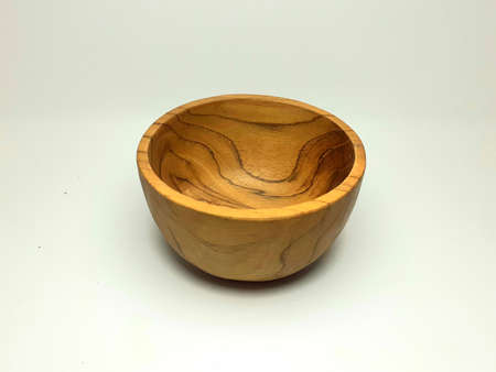 empty woodbowl in white backgroundの写真素材
