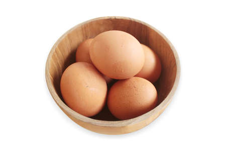 eggs in a wooden bowlの写真素材