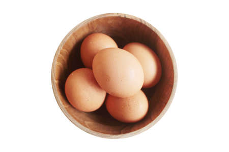 eggs in a wooden bowlの写真素材