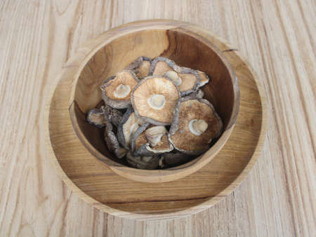 Close up Shitake Mushroom in wood bowlの写真素材