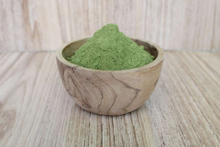 Moringa powder in a wood bowlの写真素材