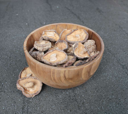 Close up Shitake Mushroom in wood bowlの写真素材