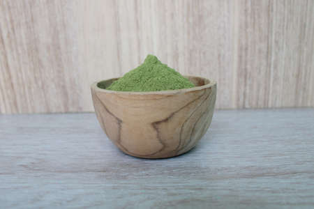 Moringa powder in a wood bowlの写真素材