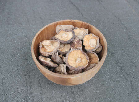 Close up Shitake Mushroom in wood bowlの写真素材